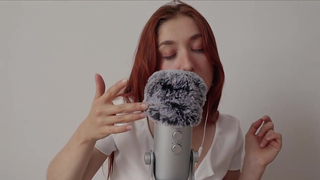 Red haired girl is rubbing a big, black dildo during an exciting, ASMR JOI session